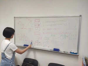 Lisa writing on whiteboard